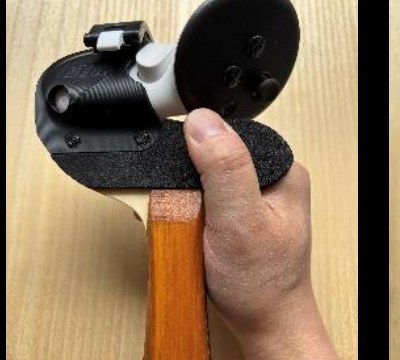 Hand gripping a HAYABUSA Type-wood adapter locked to a Quest 3 controller