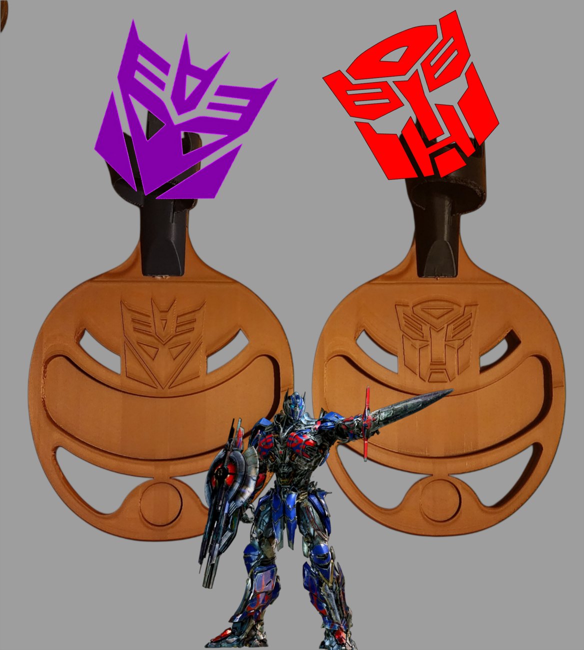 Two Ls4life adapters with engraved Autobot and Decepticon Transformers emblems